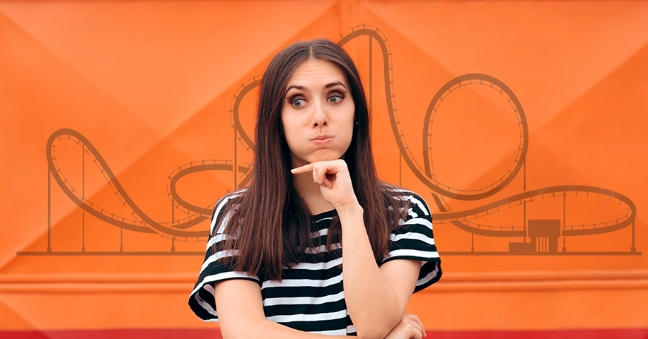 Woman in front of orange image of a roller coster